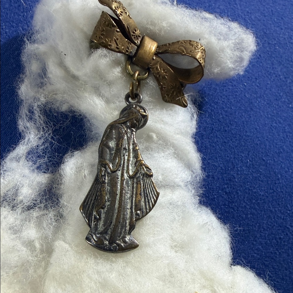 Elegant Bronze and Silver Religious Pendant